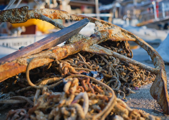 old-rusty-anchor-anchor-old-chain-marina-city-rays-rising-sun-pier-yacht-club-selective-focus-background-screen-about-seaside-vacation-travel